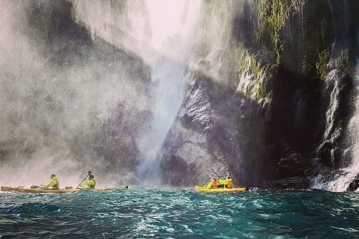 a large waterfall over some water