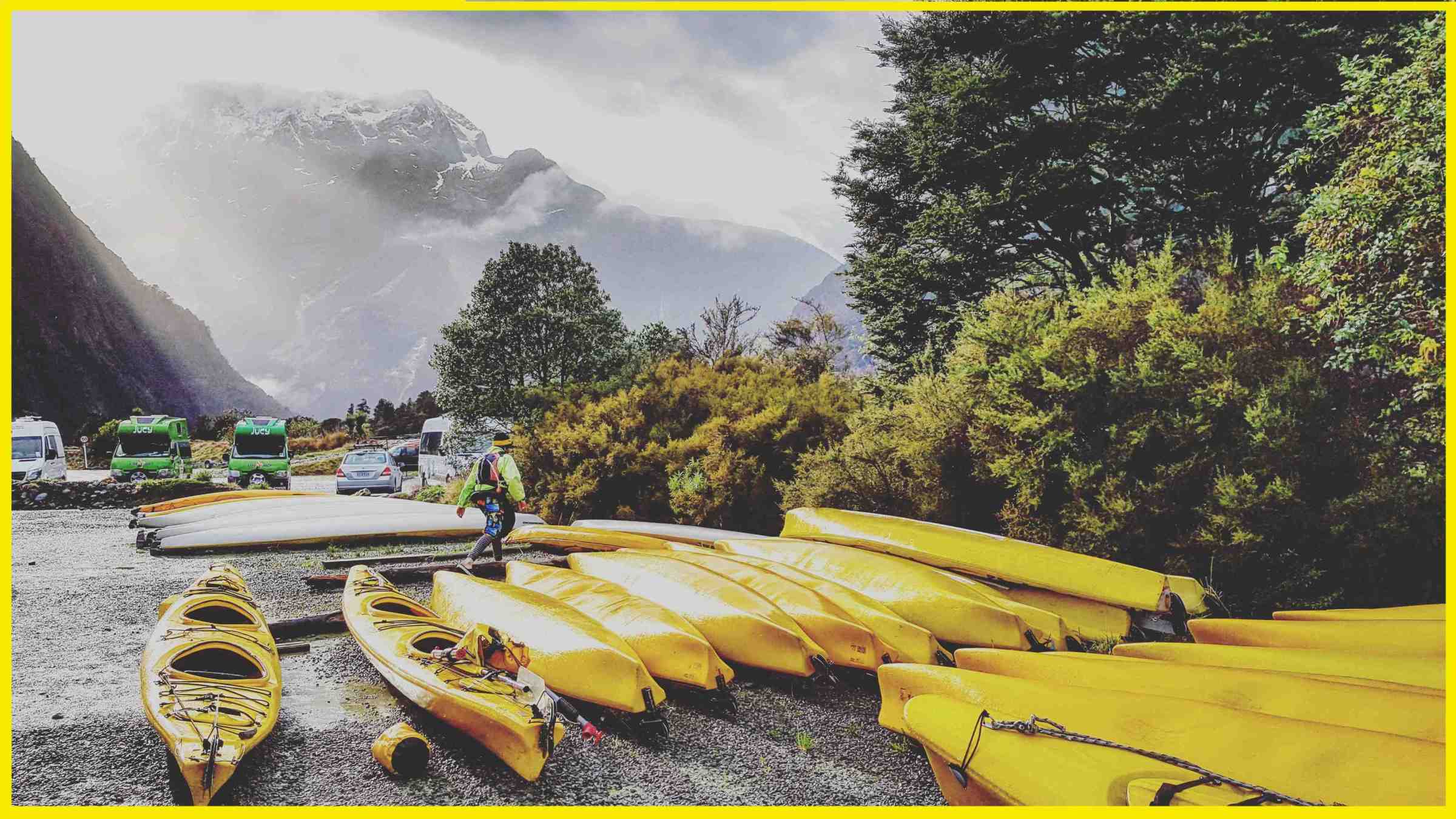 kayak-5_border a boat sitting on top of a field